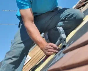 Installing New Roof Shingles.jpg e1740158360784